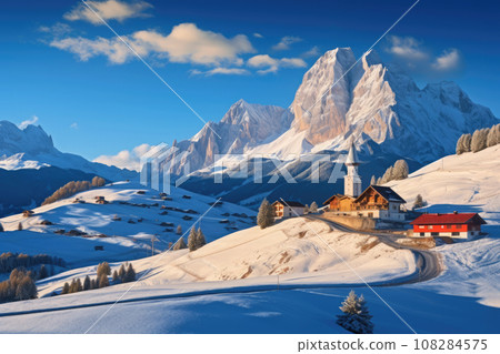 snowy winter landscape with houses, mountains and blue sky snowy winter landscape with houses, mountains and blue sky 108284575