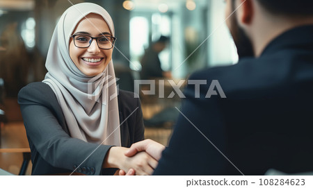 Colleagues Greet with a Handshake 108284623