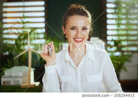 Portrait of smiling 40 years old woman realtor in green office 108284915