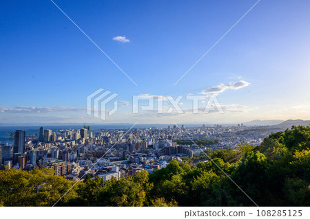 View of the city of Kobe from Kobe's elevated Venus Bridge on a sunny afternoon. 108285125