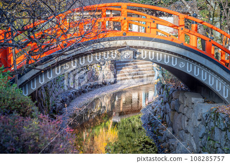Autumn at Shimogamo Shrine, the taiko bridge “Rinbashi” spanning the Mitarai River and the autumn colors reflected on the water surface Autumn at Shimogamo Shrine, the taiko bridge “Rinbashi” spanning the Mitarai River and the autumn colors reflected on the water surface 108285757