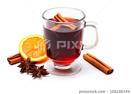 Christmas red mulled wine in cup with cinnamon sticks, orange slices and winter decorations isolated on white background 108286349