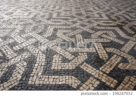 Geometric Pattern of Traditional Mosaic Tiles on Pavement in Lisbon, Portugal. Geometric Pattern of Traditional Mosaic Tiles on Pavement in Lisbon, Portugal. 108287052