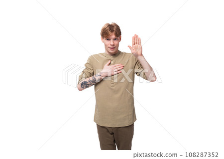 young emotional European man with red golden hair is dressed in a light brown shirt on a white 108287352