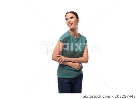 young woman in t-shirt and jeans looking away dreamily young woman in t-shirt and jeans looking away dreamily 108287442