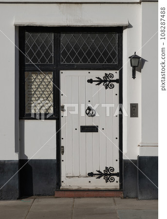 Front door of a house in De Vere Cottages and street light at South Kensington. Front door of a house in De Vere Cottages and street light at South Kensington. 108287488