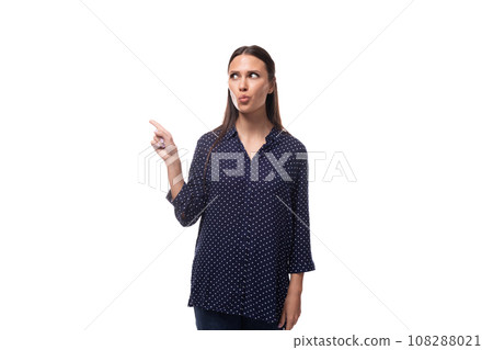 young adorable slim brunette woman dressed in blue polka dot shirt young adorable slim brunette woman dressed in blue polka dot shirt 108288021