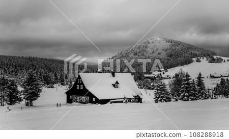 Jizerka Village and Bukovec Mounain in winter. Jizera Mountains, Czech Republic. Black and white image. 108288918