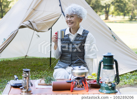 Cute lady enjoying camping 108289206