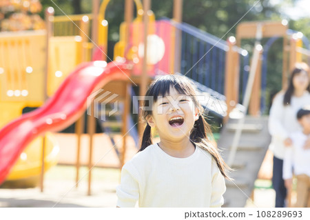 Cute child playing with play equipment 108289693