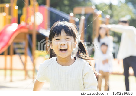 Cute child playing with play equipment 108289696