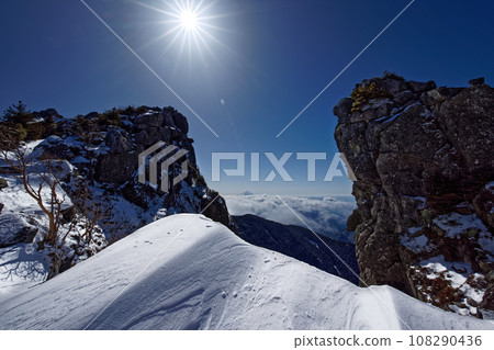 Mt. Fuji above the clouds seen from the Mt. Kinpu ridge in winter 108290436