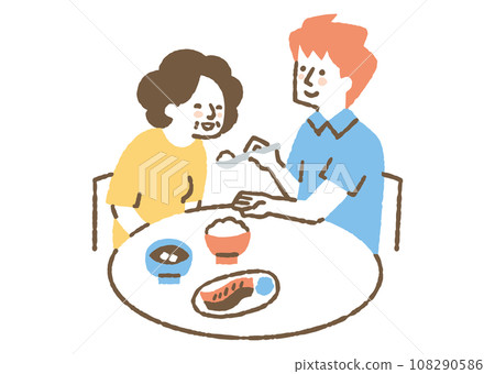 Male caregiver helping with meals_color 108290586