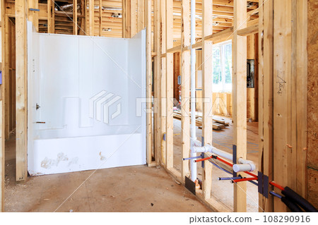 Plumbing work bathroom remodel installing new acrylic bathtub in new house Plumbing work bathroom remodel installing new acrylic bathtub in new house 108290916