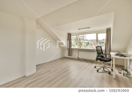 an empty room with a desk, chair and window overlooking the cityscapea photo taken on august 20, 2012 an empty room with a desk, chair and window overlooking the cityscapea photo taken on august 20, 2012 108291669