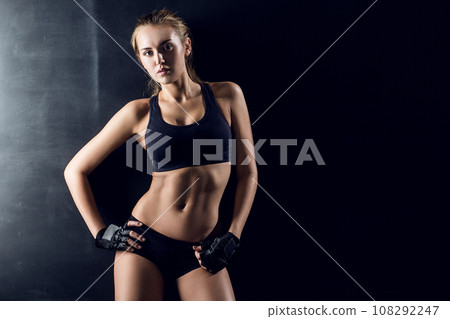 Confident Young Athlete Showcasing Active Lifestyle in Sports Clothing Confident Young Athlete Showcasing Active Lifestyle in Sports Clothing 108292247