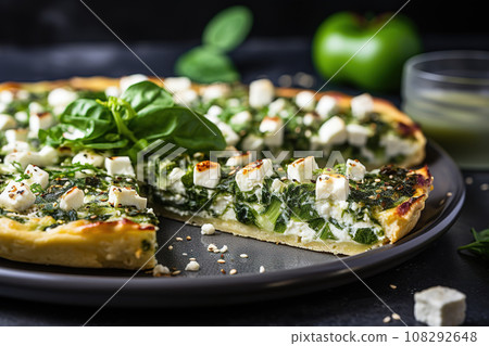 Vegan spinach and feta pizza on plate, close up 108292648