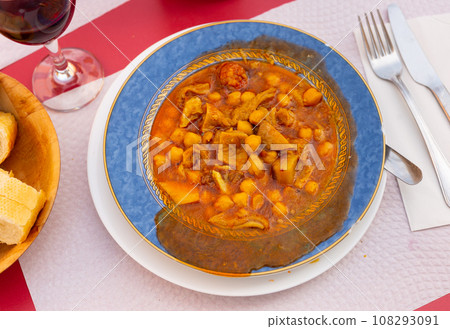 Stew with tripe, chickpea, chorizo and bacon in sauce Stew with tripe, chickpea, chorizo and bacon in sauce 108293091