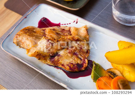 Iberian pork in sweet wine and vegetable sauce 108293294