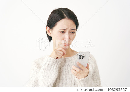 A woman who has trouble holding a smartphone, white background 108293837