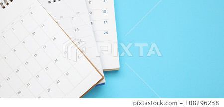 calendar page close up on blue background business planning appointment meeting concept 108296238