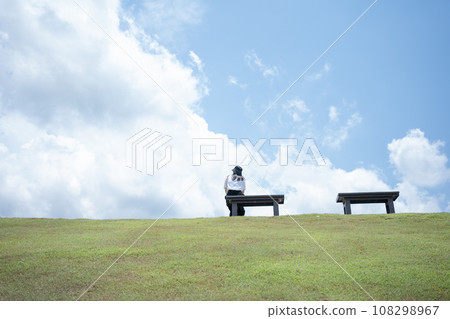 solo woman happy and enjoy with summer travel with cloudy background 108298967