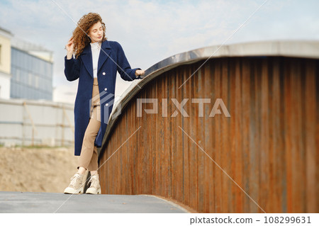 Woman standing on the bridge Woman standing on the bridge 108299631