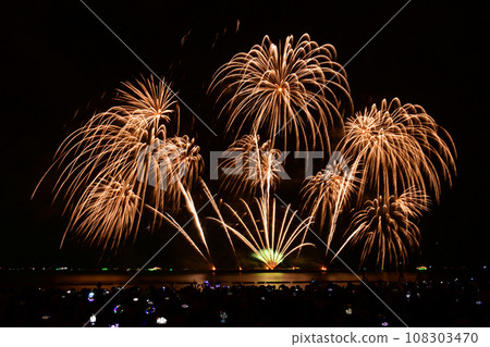 People capturing fireworks show with camera and smart phone in Pattaya fireworks festival. 108303470