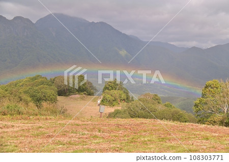 Rainbow bridge over the ski slopes of a ski resort Rainbow bridge over the ski slopes of a ski resort 108303771