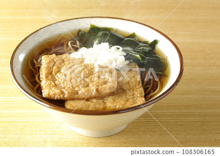 Hot fox soba with two pieces of fried tofu, wakame seaweed, and green onions. Hot fox soba with two pieces of fried tofu, wakame seaweed, and green onions. 108306165