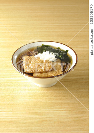 Hot fox soba with two pieces of fried tofu, wakame seaweed, and green onions. Hot fox soba with two pieces of fried tofu, wakame seaweed, and green onions. 108306179