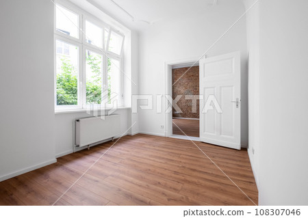 empty flat, unfurnished room after renovation with big window 108307046
