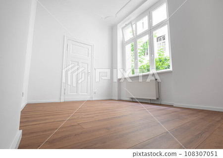 empty apartment room,window and flat door, low angle view empty apartment room,window and flat door, low angle view 108307051