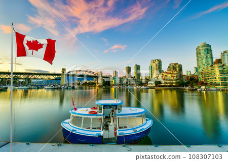 Ferry boat docked along in Granville island near Burrard Street Bridge at twilight in Vancouver,Canada 108307103