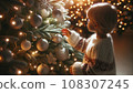 Child in front of Christmas tree 108307245