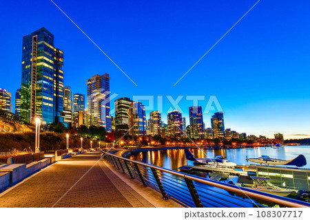 Beautiful view of Vancouver skyline with harbor at sunset, British Columbia, Canada Beautiful view of Vancouver skyline with harbor at sunset, British Columbia, Canada 108307717