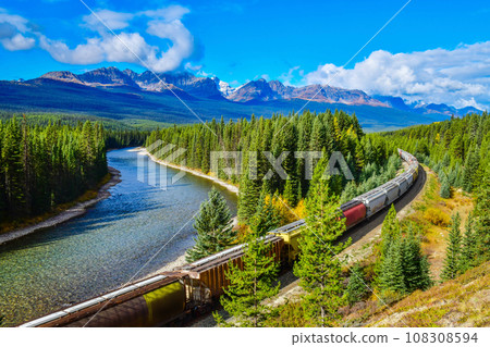 Train passing famous Morant's curve at Bow Valley in autumn ,Banff National Park, Canadian Rockies,Canada. Train passing famous Morant's curve at Bow Valley in autumn ,Banff National Park, Canadian Rockies,Canada. 108308594