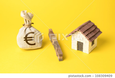 The house and the euro money bag are separated by a barrier. Stop overheating real estate market. Investment as a threat to create a market bubble. The influx of capital. High levels of debt, The house and the euro money bag are separated by a barrier. Stop overheating real estate market. Investment as a threat to create a market bubble. The influx of capital. High levels of debt, 108309409