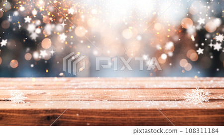 Empty wooden tabletop on background of Christmas lights, sparkling garlands, bokeh, copy space. Postcard, flyer 108311184