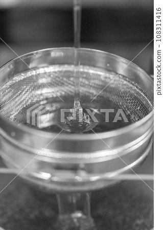 Drop of bee honey drip from hexagonal honeycombs Drop of bee honey drip from hexagonal honeycombs 108311416