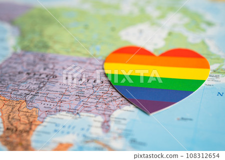 Bangkok, Thailand, June 1, 2022 Rainbow color heart on USA America globe world map background, LGBT pride month. Bangkok, Thailand, June 1, 2022 Rainbow color heart on USA America globe world map background, LGBT pride month. 108312654