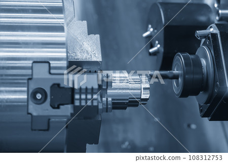 The CNC lathe machine milling cut the metal shaft parts. The CNC lathe machine milling cut the metal shaft parts. 108312753