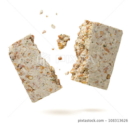 Pea soup briquette broken in half flies on a white background. Isolated Pea soup briquette broken in half flies on a white background. Isolated 108313626