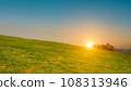 beautiful grass field with sunset or sunrise sky. Countryside landscape view background. 108313946