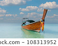 Thai traditional wooden longtail boat and beautiful sand Railay Beach in Krabi province, Thailand. 108313952