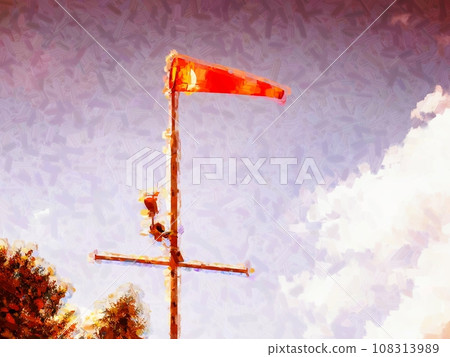 Windscock and flag flutter in the wind on a tall pole. The weather station measures the wind 108313989