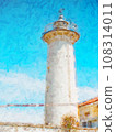 Popular white lighthouse with a concrete tower and an active light by a quiet beach. Popular white lighthouse with a concrete tower and an active light by a quiet beach. 108314011