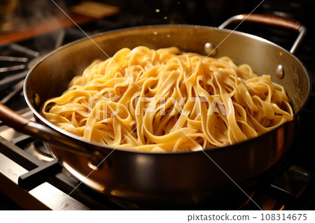 Pot with freshly cooked steaming pasta 108314675