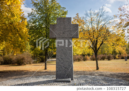 Stone tombstones in the German cemetery in the fall. Beautiful German cemetery near Kyiv. Many dead German soldiers of the dead during the 2nd World War. 108315727