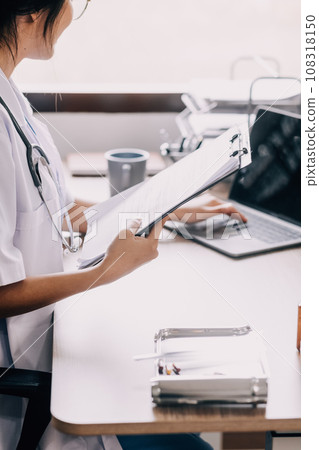 Medical technology concept. Doctor working with mobile phone and stethoscope in modern office Medical technology concept. Doctor working with mobile phone and stethoscope in modern office 108318150